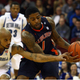 Varez Ward (right) fends off Jordan Theodore. (Chris Chambers/Getty Images)
